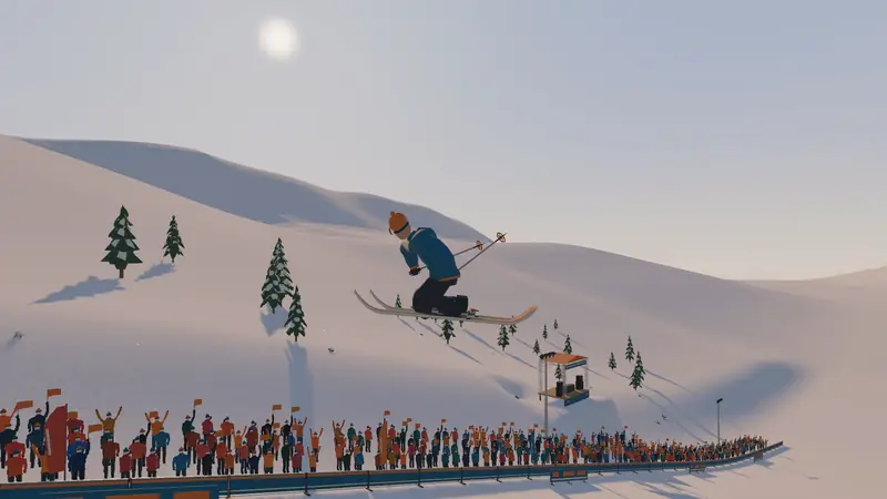 A skier in a blue jacket and orange beanie holds a mute grab mid-spin above a stadium jump, with a cheering crowd behind the barrier and a DJ stage on the slope.
